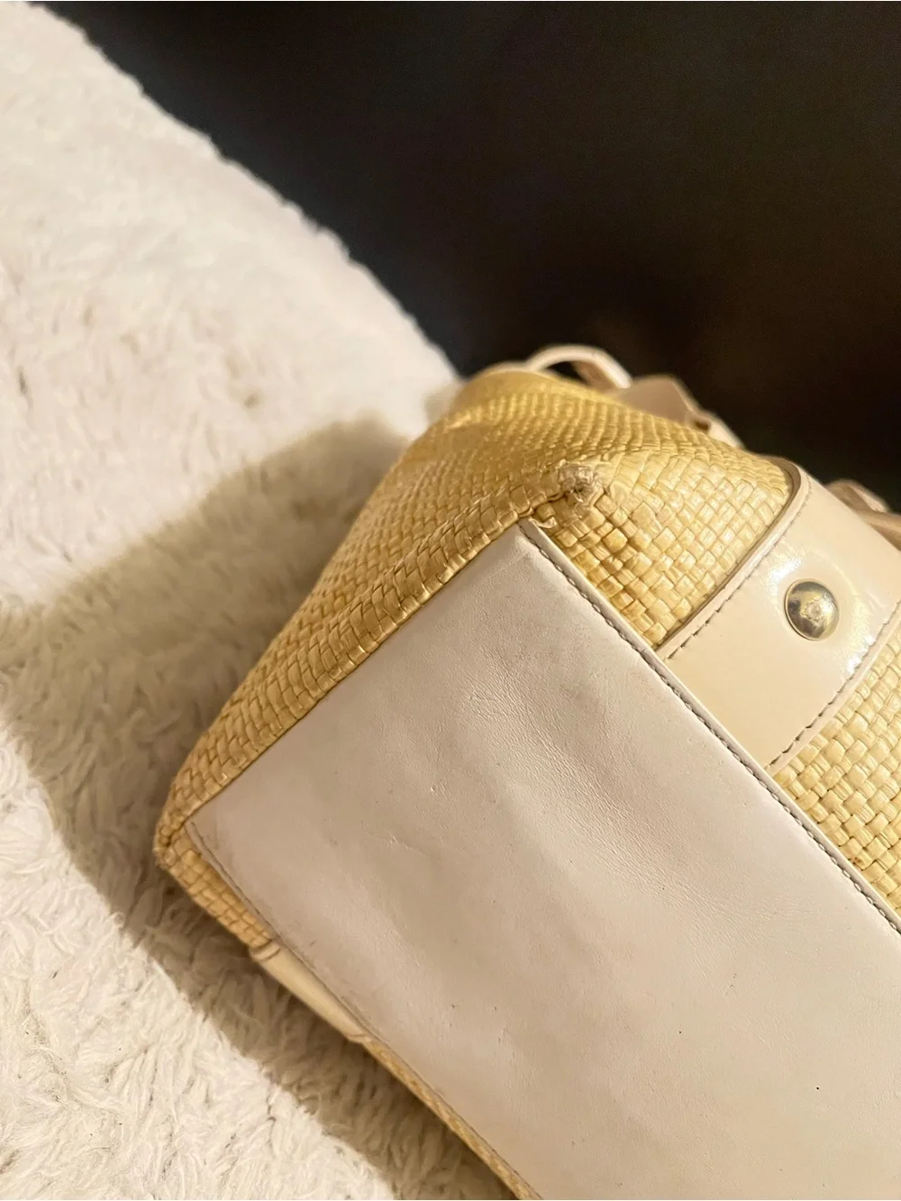 Coach white leather and straw tote.